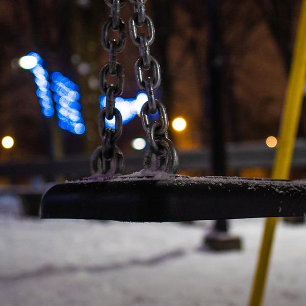 an empty swing at a park