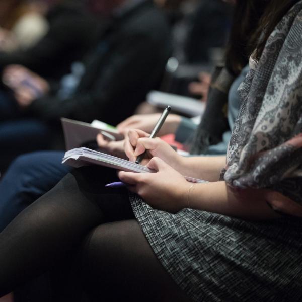 Audience members sit in chairs. (Photo by The Climate Reality Project on Unsplash)