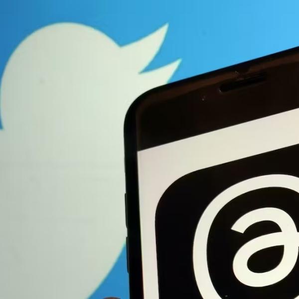 A graphic show a Threads and Twitter logo.