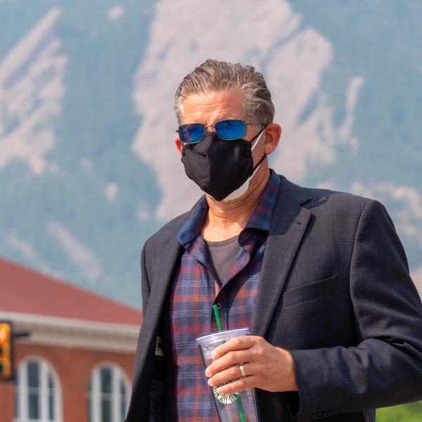 Man wearing two masks