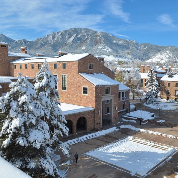 Snowy University Memorial Center with flatirons in background