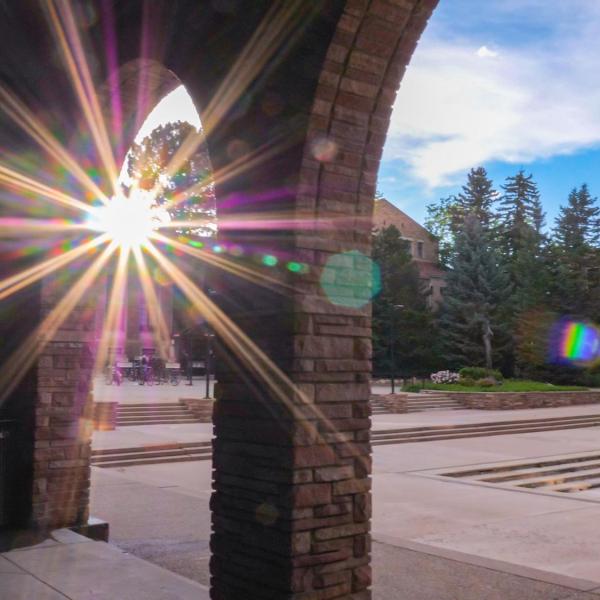 The sun sets behind the UMC loggia.