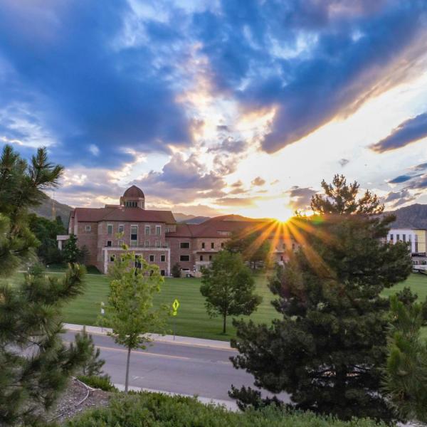 Sun peeking over campus views