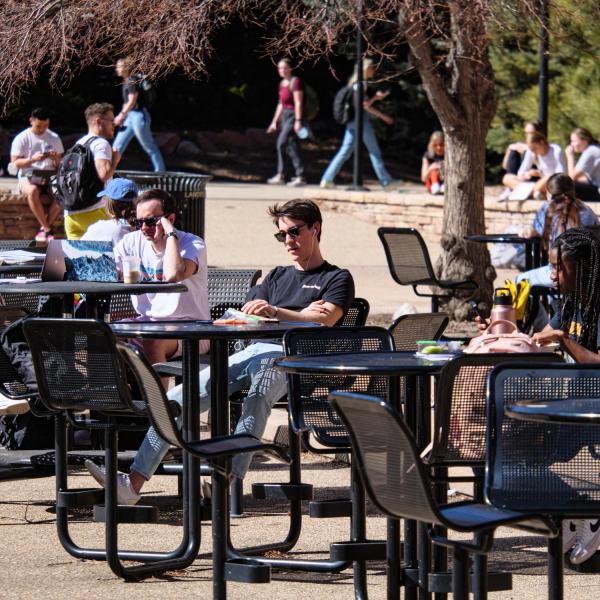 Students catch up on studying and relaxing at the UMC fountain area