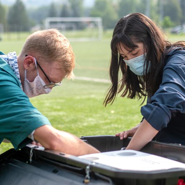 Researchers check on a sampling station