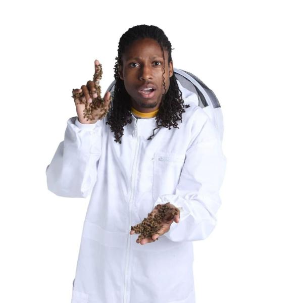Samuel Ramsey, in a white lab coat, is covered with bees.