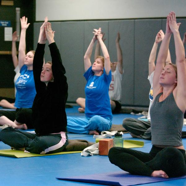 Students participate in a yoga class at the Rec Center
