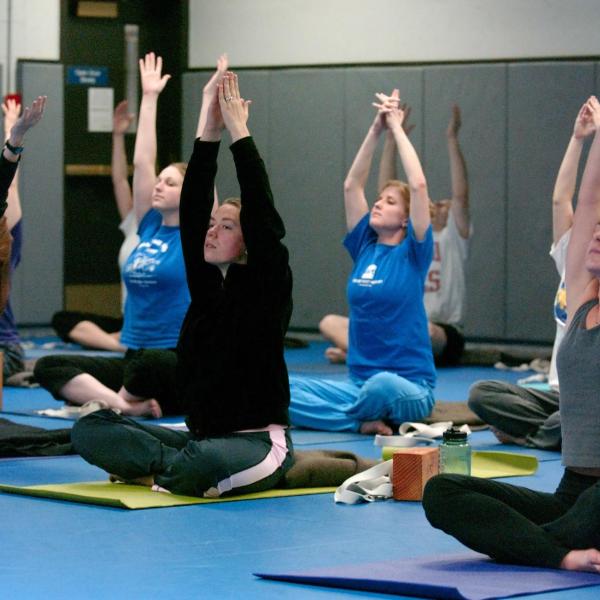 Students partaking in yoga class at The Rec