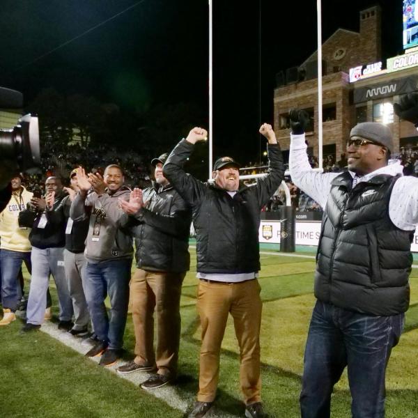 Kordell Stewart, right, joins teammates from the 1994 Miracle at Michigan team to be recognized on the field during Colorado's game against Washington on Saturday, Nov. 23, 2019. (Photo by Glenn Asakawa/University of Colorado)