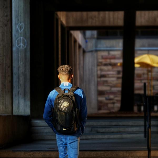 Students walk across campus on the first day of the spring 2020 semester at CU Boulder. (Photo by Glenn Asakawa/University of Colorado)