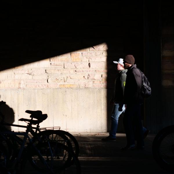 Students walk across campus on the first day of the spring 2020 semester at CU Boulder. (Photo by Glenn Asakawa/University of Colorado)