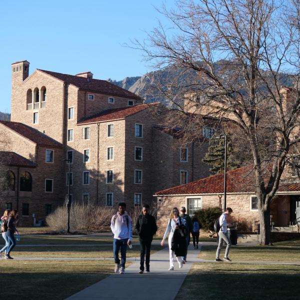 Students walk across campus on the first day of the spring 2020 semester at CU Boulder. (Photo by Glenn Asakawa/University of Colorado)