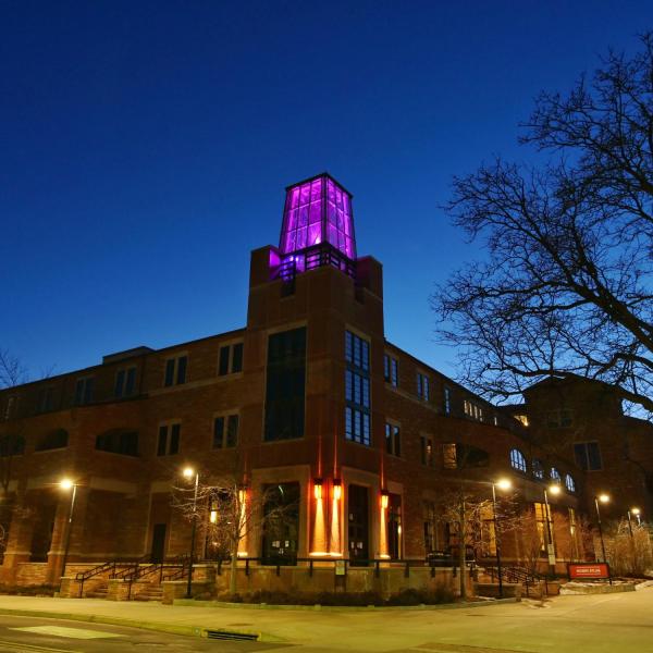 On March 5, the Roser ATLAS building shines magenta––part of the state of Colorado's COVID-19 anniversary remembrance. (Photo by Glenn Asakawa/CU Boulder)