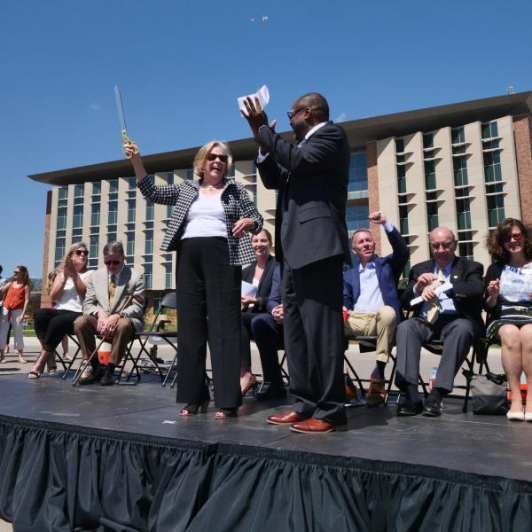 Ann Smead, left, and Brian Argrow, chair of the aerospace engineering department, pose following a ribbon-cutting ceremony at the new Aerospace Engineering Sciences Building at CU Boulder. (Photo by Glenn Asakawa/CU Boulder)
