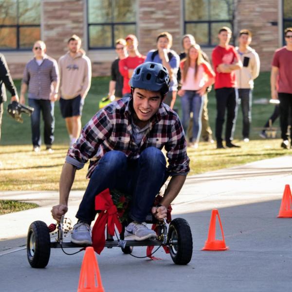 Kevin Phan negotiates cones set up on the speed course for the drill-powered cars.