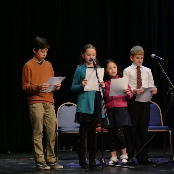 Children provide a short history and biography of Martin Luther King at the the MLK Day Celebration.