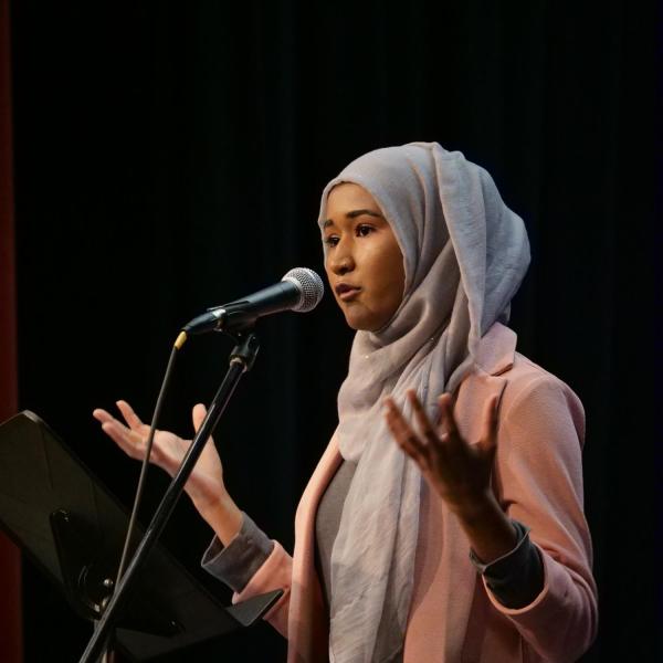 Heraa Hashmi, president of the CU Muslim Student Association, speaks at the MLK Day Celebration.