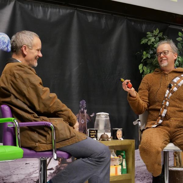 Guest speaker Valerio Ferme, dean of the College of Arts and Letters at Northern Arizona University, left, is questioned by Pathways to Space instructor Chris Koehler. Photo by Glenn Asakawa.