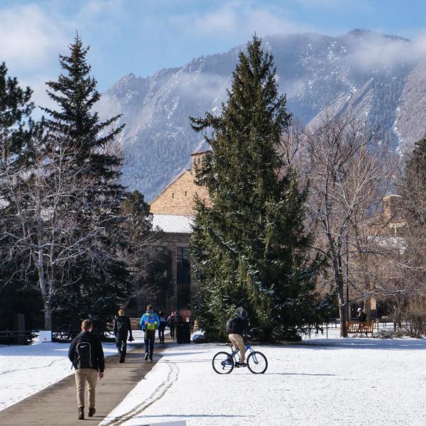 A little snow and cold never stops cyclists on the CU Boulder campus. Photo by Glenn Asakawa.