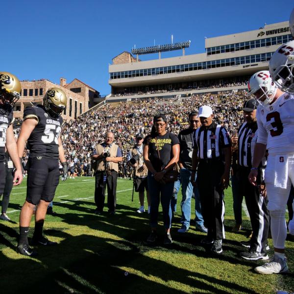 Student veteran Nisa Jovel participates in the coin toss at the start of the Colorado-Stanford football game on Saturday, Nov. 9, 2019. (Photo by Glenn Asakawa/University of Colorado)