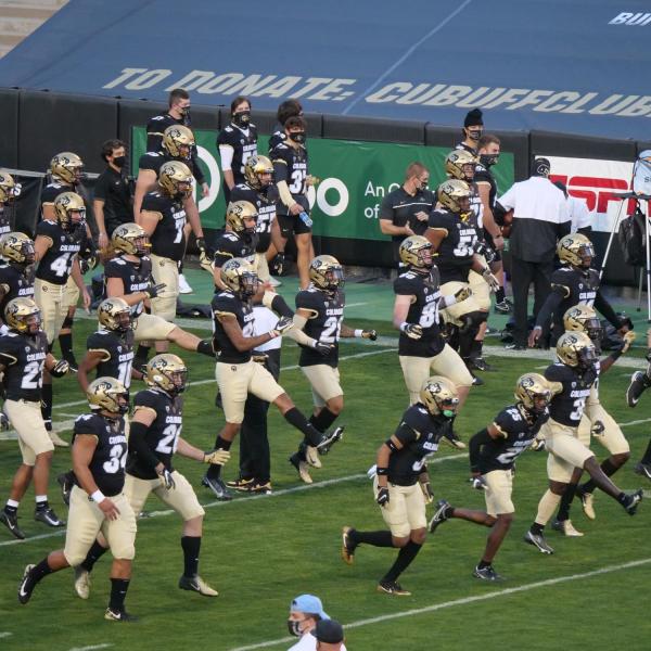 Colorado football players warm up before their game against UCLA on Saturday, Nov. 7, 2020. (Photo by Glenn Asakawa/University of Colorado)