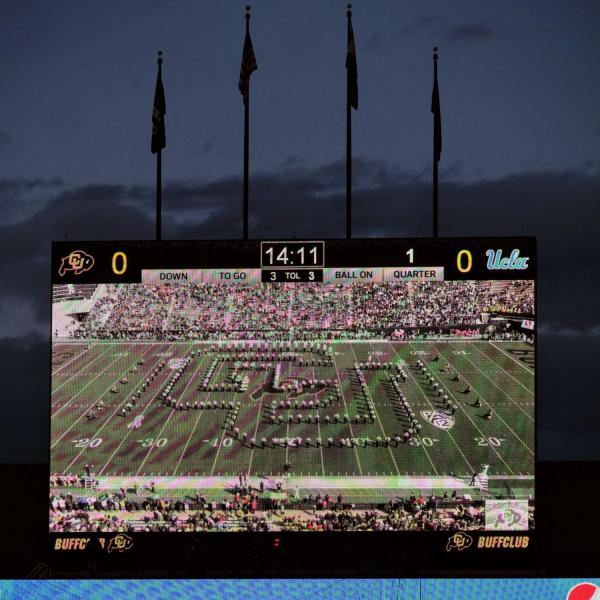 A performance from the University of Colorado Golden Buffalo Marching Band from last season is shown on the scoreboard before the Colorado vs. UCLA football game. (Photo by Glenn Asakawa/University of Colorado)