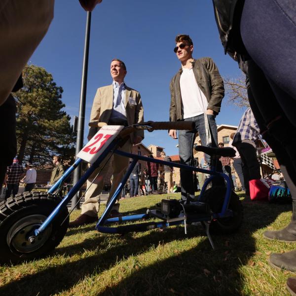 Team Blood Sweat and Gears, including Tim Visos-Ely of Gardener, Kansas, explains their design to Dean Bobby Braun (left).