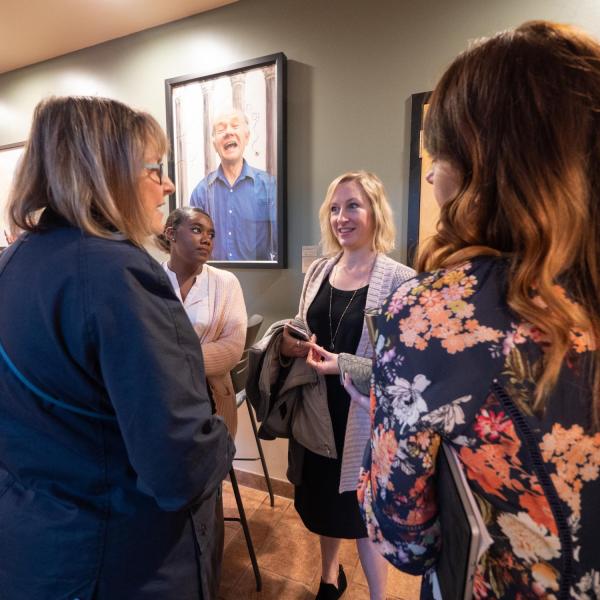 An informal discussion occurs after the session on a focus on racial equity: Boulder's Partnership with the Government Alliance on Racial Equity (GARE). Photo by Glenn Asakawa.