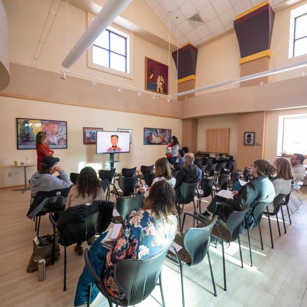 Participants watch a short video during a session on What the Heck is Intersectionality?! with Scarlet Bowen and Sarah Rimmel, Center for Inclusion and Social Change. Photo by Glenn Asakawa.