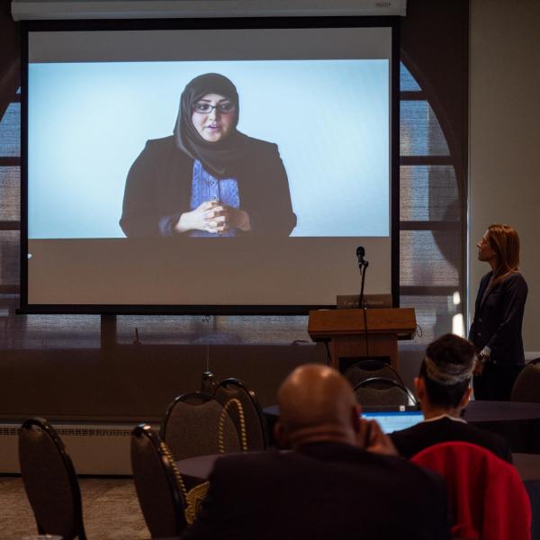 Erica Kuhl, vice president of Community at Salesforce, right, kicks off her talk titled Creative Inclusive Communities at Salesforce with a video. Photo by Glenn Asakawa.