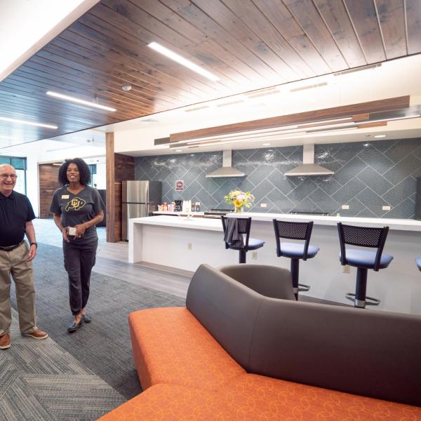 Chancellor Phil DiStefano, center, looks over the main lobby with Hall Director Shane Guinan, left, and Akirah Bradley, Associate Vice Chancellor for Student Affairs during during move-in on Wednesday, Aug. 21, 2019, at Williams Village East. (Photo by Glenn Asakawa/University of Colorado)