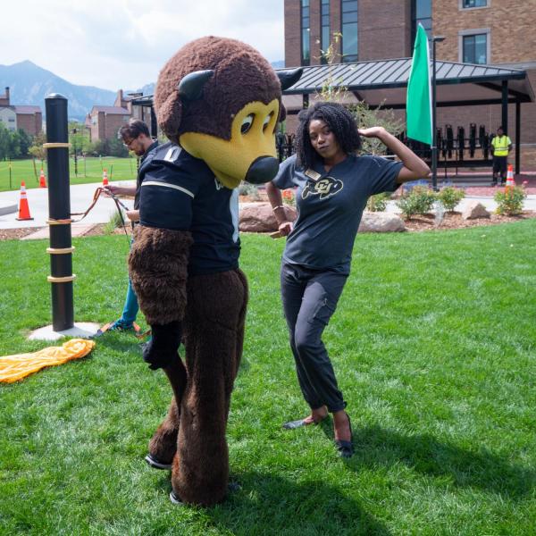 Akirah Bradley, Associate Vice Chancellor for Student Affairs, poses with Chip during move-in on Wednesday, Aug. 21, 2019, at Williams Village East. (Photo by Glenn Asakawa/University of Colorado)