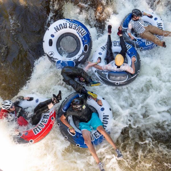 Brave tubers float down Boulder Creek for the 2019 Tube to Work Day.