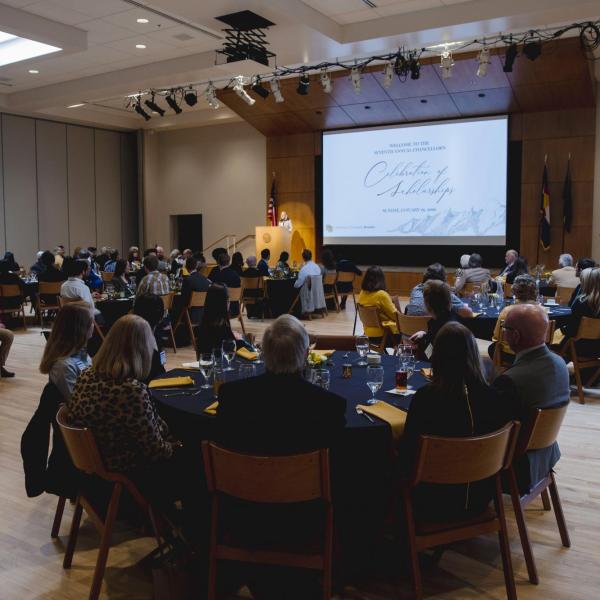 Guests at the annual Chancellor’s Celebration of Scholarships Luncheon listen to welcoming remarks by Mary Kraus, vice provost and associate vice chancellor for undergraduate education. (Photo by Matt Tyrie/CU Boulder)