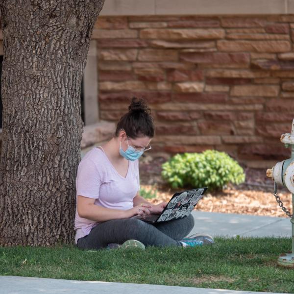 Students, wearing facial coverings and practicing proper social distancing protocols, participate in classes and study on the first day of the 2020 fall semester on the CU Boulder campus. (Glenn Asakawa/University of Colorado)