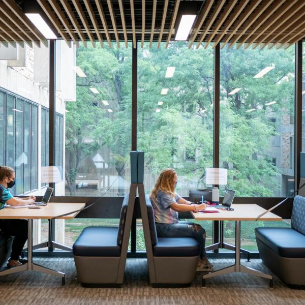 Students, staff and faculty, all wearing facial coverings and practicing proper social distancing protocols, study at the Engineering Center on the first day of the 2020 Fall semester on the CU Boulder Campus. (Photo by Glenn Asakawa/University of Colorado)