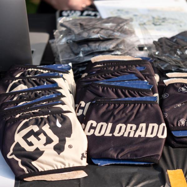 Branded masks for all students, faculty and staff with Buff One cards are available at help tents across the campus. Students, staff and faculty, all wearing facial coverings and practicing proper social distancing protocols, participate in classes and study on the first day of the 2020 Fall semester on the CU Boulder Campus. (Photo by Glenn Asakawa/University of Colorado)