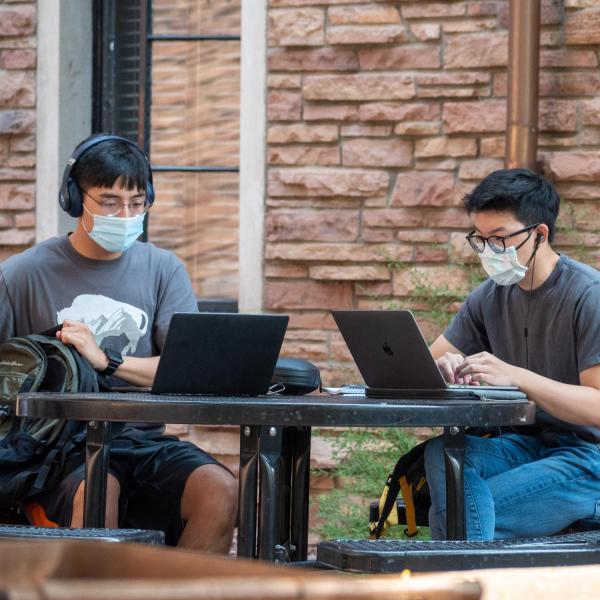 Students, staff and faculty, all wearing facial coverings and practicing proper social distancing protocols, participate in classes and study on the first day of the 2020 Fall semester on the CU Boulder Campus. (Photo by Glenn Asakawa/University of Colorado)
