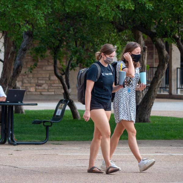 Students, staff and faculty, all wearing facial coverings and practicing proper social distancing protocols, participate in classes and study on the first day of the 2020 Fall semester on the CU Boulder Campus. (Photo by Glenn Asakawa/University of Colorado)