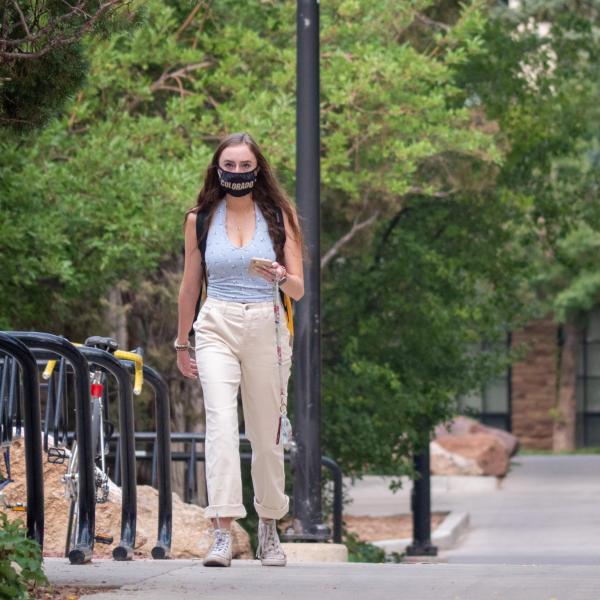 Students, staff and faculty, all wearing facial coverings and practicing proper social distancing protocols, participate in classes and study on the first day of the 2020 Fall semester on the CU Boulder Campus. (Photo by Glenn Asakawa/University of Colorado)