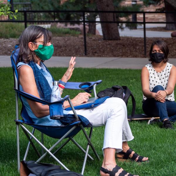 Professor Tina Pittman leads a clinical psychology practicum for graduate students in a courtyard near Ketchum Arts and Sciences building. Students, staff and faculty, all wearing facial coverings and practicing proper social distancing protocols, participate in classes and study on the first day of the 2020 Fall semester on the CU Boulder Campus. (Photo by Glenn Asakawa/University of Colorado)