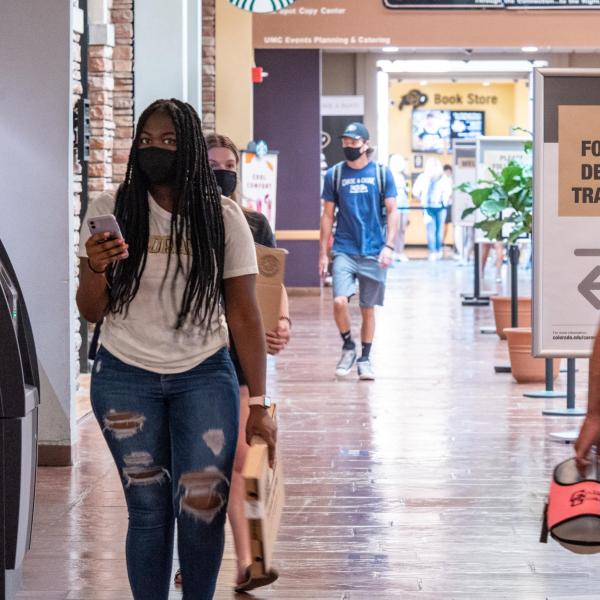 Signs indicated proper direction in the UMC. Students, staff and faculty, all wearing facial coverings and practicing proper social distancing protocols, participate in classes and study on the first day of the 2020 Fall semester on the CU Boulder Campus. (Photo by Glenn Asakawa/University of Colorado)