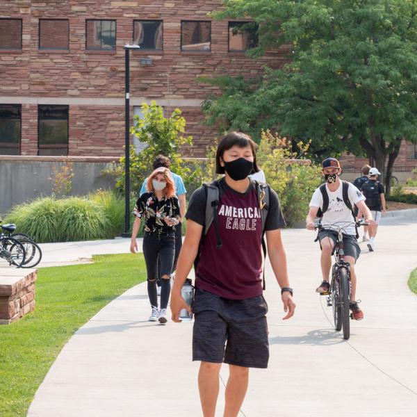 Students, staff and faculty, all wearing facial coverings and practicing proper social distancing protocols, participate in classes and study on the first day of the 2020 Fall semester on the CU Boulder Campus. (Photo by Glenn Asakawa/University of Colorado)