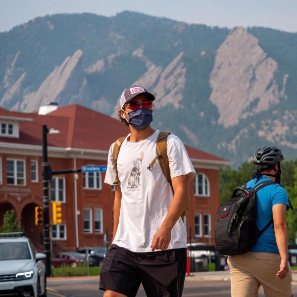 Students, staff and faculty, all wearing facial coverings and practicing proper social distancing protocols, participate in classes and study on the first day of the 2020 Fall semester on the CU Boulder Campus. (Photo by Glenn Asakawa/University of Colorado)
