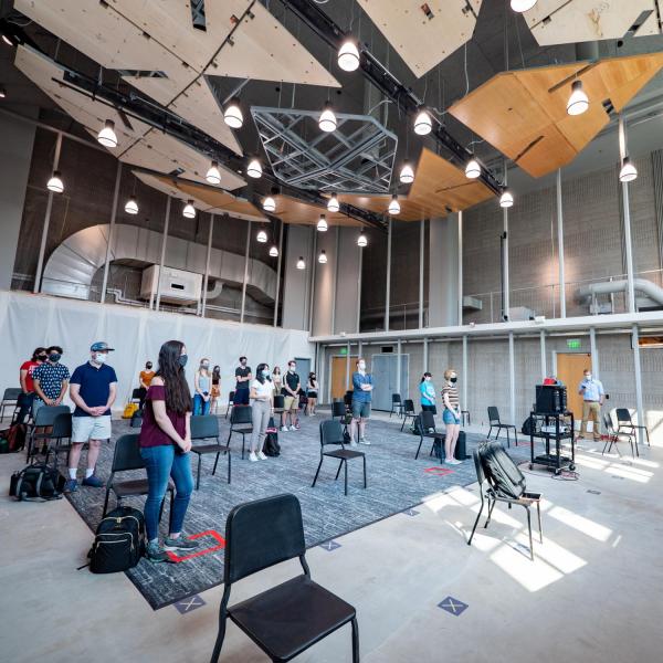 Undergraduate students participate in Associate Professor and CU Director of Bands Donald McKinney's conducting class in the new wing of the College of Music Imig building. (Photo by Glenn Asakawa/University of Colorado)
