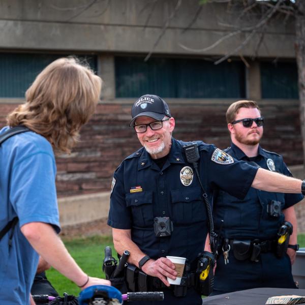 Students meet with CUPD officers during the semester's first Coffee with a Cop event. (Photo by Patrick Campbell/University of Colorado)