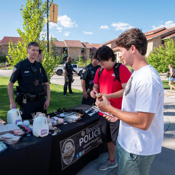 Students meet with CUPD officers during the semester's first Coffee with a Cop event. (Photo by Patrick Campbell/University of Colorado)