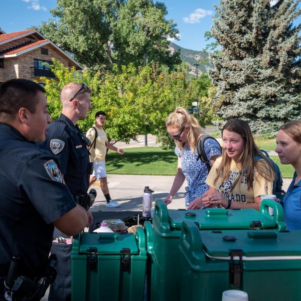 Students meet with CUPD officers during the semester's first Coffee with a Cop event. (Photo by Patrick Campbell/University of Colorado)