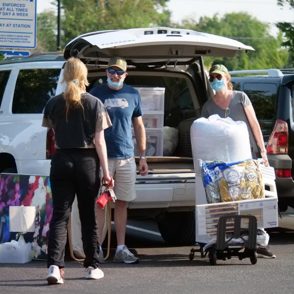 First-year students, parents, staff and volunteers welcome each other back on the CU Boulder campus in the Williams Village Complex on Monday, Aug.16, 2021. (Photo by Glenn Asakawa/University of Colorado)