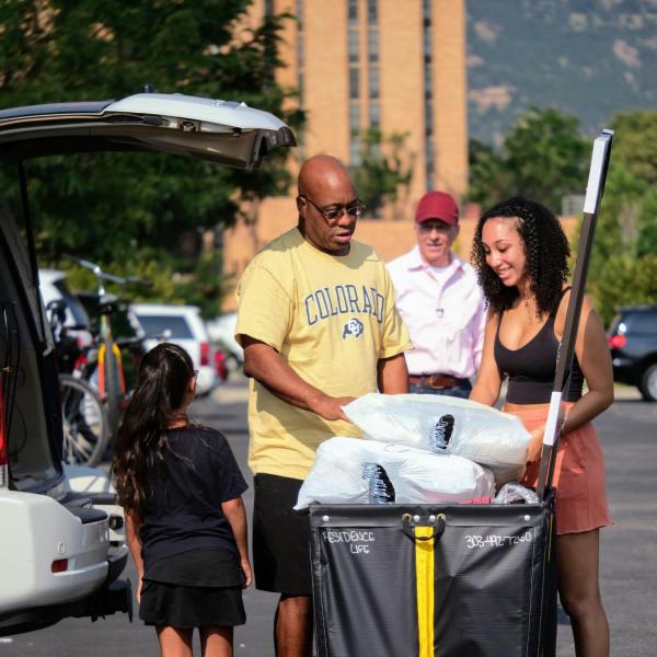 First-year students, parents, staff and volunteers welcome each other back on the CU Boulder campus in the Williams Village Complex on Monday, Aug.16, 2021. (Photo by Glenn Asakawa/University of Colorado)